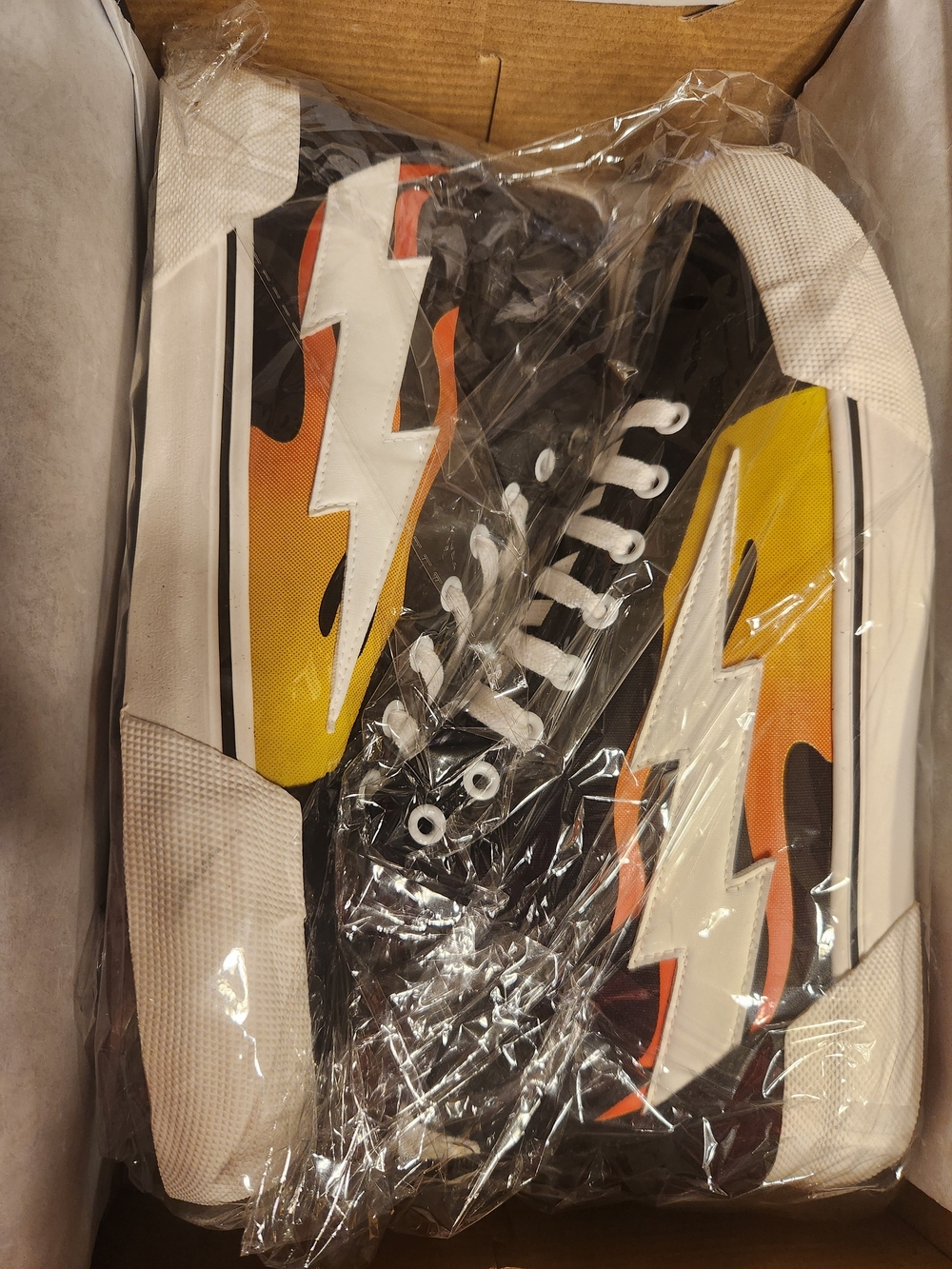 Revenge X Storm Black Canvas Sneakers with Yellow-Orange Flame Lightning Design